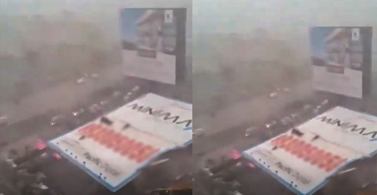 Falling billboard during heavy Mumbai rain storm